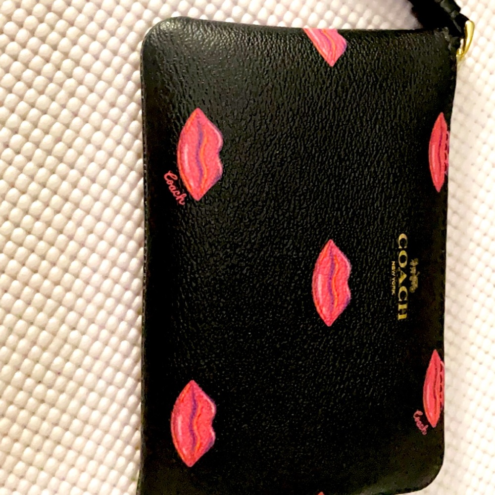 Coach Wrislet black with pink lips